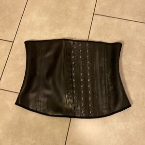Ann Mitchell woman’s latex corset
